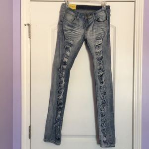 Extremely distressed skinny low rise jeans.